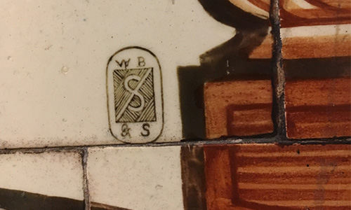 W.B. Simpsons logo on tile